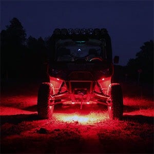 Image of the same off-road vehicle showcasing rock lights in red.
